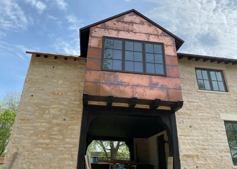 Copper metal panel facade on a stone building for Skylight Installation in South San Jose Hills