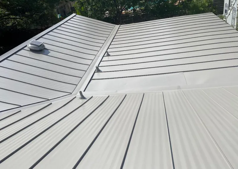 Solar attic fan installed on a metal roof for Roof Ventilation in South San Jose Hills